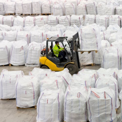 businessman-and-workers-among-large-bags-of-recycl-2026-01-11-09-39-07-utc