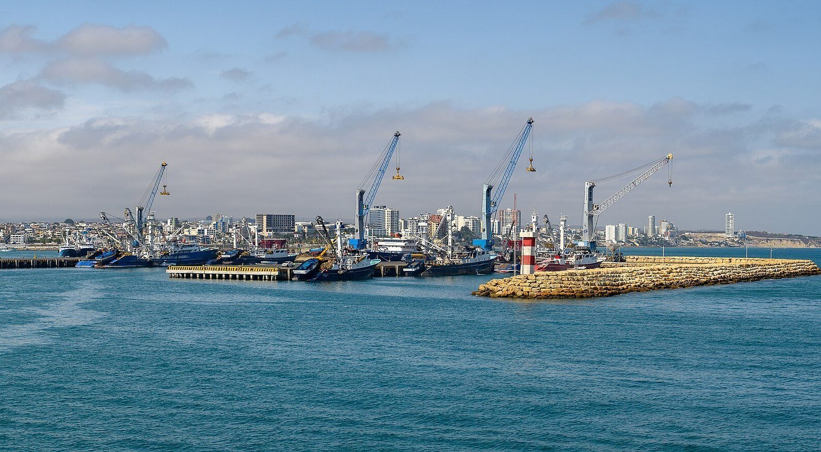 Harbour cranes and quays at the Port of Manta, Ecuador, seen from the sea