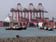 Ship-to-shore cranes and tugboats at the container terminal in Callao harbour, Peru