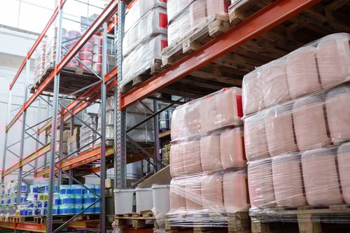 canisters-into-stretch-wrap-placed-on-pallets-at-s-2023-11-27-04-50-48-utc