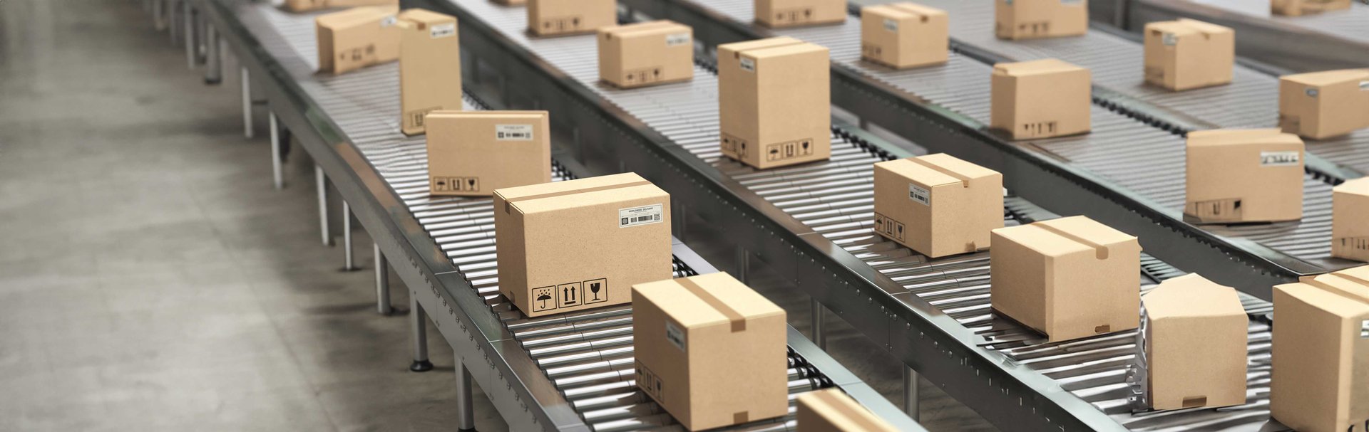 cardboard-boxes-on-conveyor-roller-in-distribution-2023-11-27-05-29-43-utc
